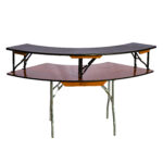 Introducing T3 Event Rentals sleek two-tier wooden DJ table available for rent in Atlanta. With a black top and sturdy metal legs, this piece combines functionality and style. The curved structure is reminiscent of Rectangle Folding Tables, making it ideal for accommodating DJ equipment, while the elevated upper surface provides additional space for display or gear. Perfect for your next event in the heart of Atlanta, this rental item from T3 Event Rentals is sure to impress.