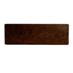 A stunning rectangular wooden tabletop, showcasing a rich brown finish with visible wood grain, is prominently displayed against a white background. This Rectangle Folding Table from T3 Event Rentals bears signs of aging and wear that enhance its rustic charm, making it perfect for your event in Atlanta. Remember, all items are rentals and can be provided by T3 Event Rentals for your special occasions in the area!.