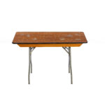 Experience the rustic charm of well-used folding tables with T3 Event Rentals in Dawsonville. This rental option features a classic design: worn brown wooden tops complemented by gray metal legs, marked with scratches and signs of frequent use. Perfect for any event in Dawsonville, these tables offer the perfect blend of durability and character. Choose T3 Event Rentals for all your event needs!.