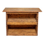 Experience the charm of The Tin Bar, a rustic wooden bookshelf available for rent in Atlanta through T3 Event Rentals. Featuring two shelves with a natural, unfinished look, this piece enhances any vintage or farmhouse aesthetic. Its aged, textured wood stands out beautifully against a white background, making it perfect for your next event.