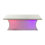 Lit Delano Table. White cover with 2 different colored LED's under the table.