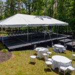 Event photos of our staging leveling out a back yard to house a tent.