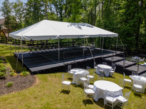 Event photos of our staging leveling out a back yard to house a tent.