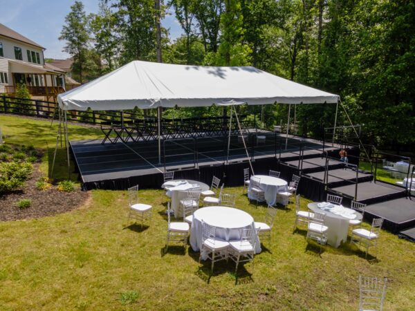 Event photos of our staging leveling out a back yard to house a tent.