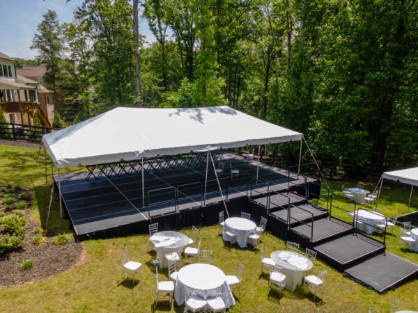 Event photos of our staging leveling out a back yard to house a tent.