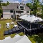 Event photos of our staging leveling out a back yard to house a tent.