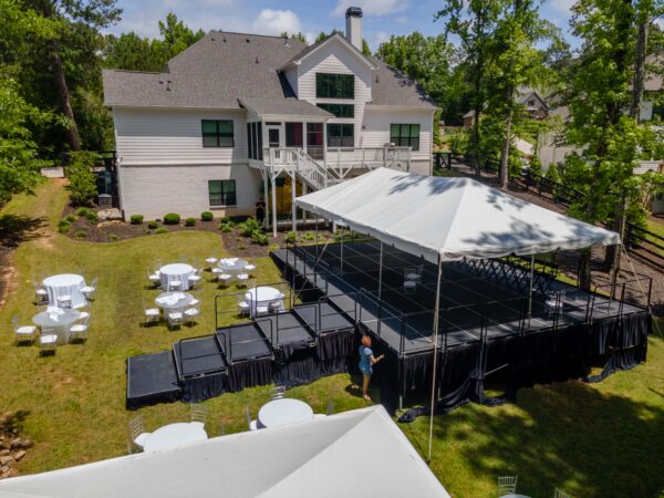 Event photos of our staging leveling out a back yard to house a tent.