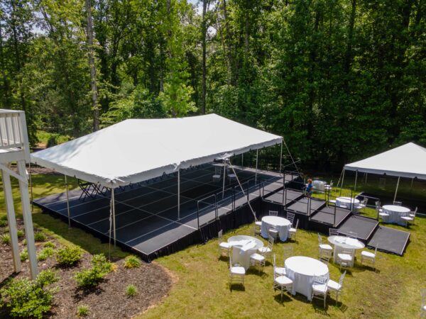 Event photos of our staging leveling out a back yard to house a tent.