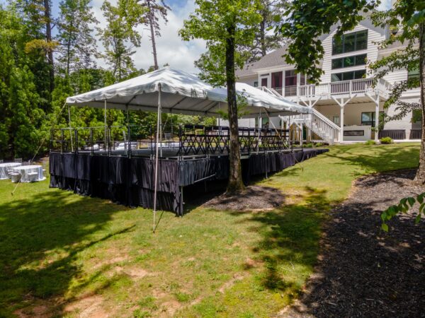 Event photos of our staging leveling out a back yard to house a tent.