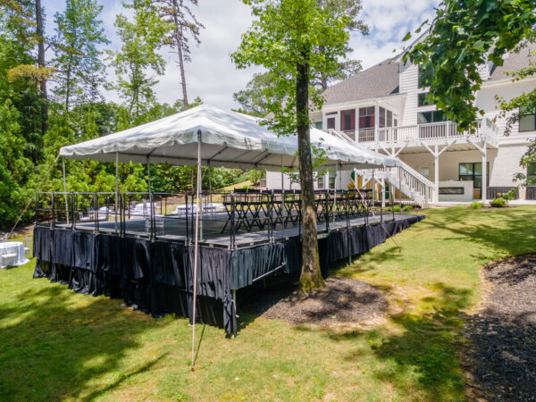 Event photos of our staging leveling out a back yard to house a tent.