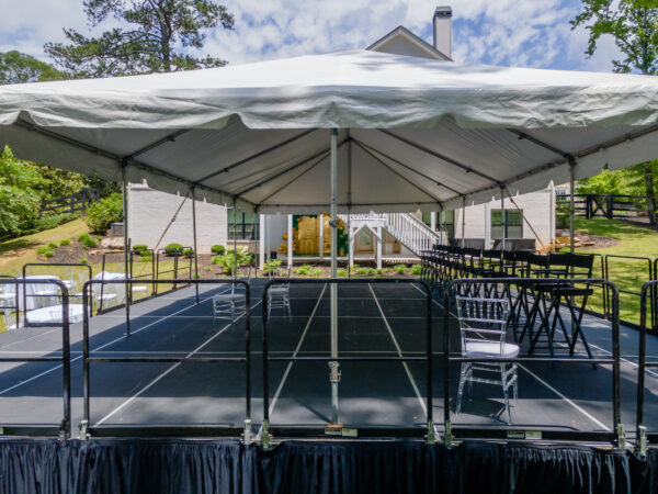 Event photos of our staging leveling out a back yard to house a tent.