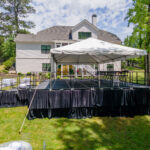 Event photos of our staging leveling out a back yard to house a tent.