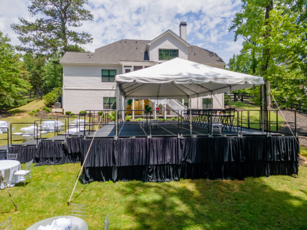 Event photos of our staging leveling out a back yard to house a tent.