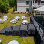 Event photos of our staging leveling out a back yard to house a tent.
