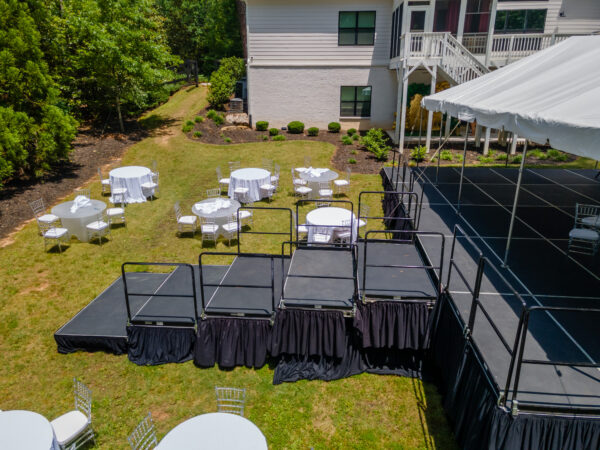 Event photos of our staging leveling out a back yard to house a tent.