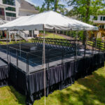 Event photos of our staging leveling out a back yard to house a tent.