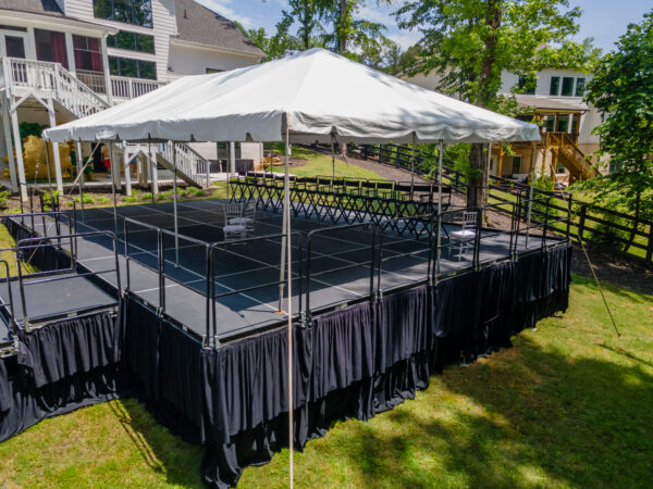 Event photos of our staging leveling out a back yard to house a tent.