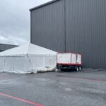 Event photo of our 25 ton ac unit in use cooling a frame tent powered by our generator.