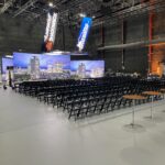 Event Photo of black resin chairs at a networking event.