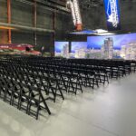 Event Photo of black resin chairs at a networking event.