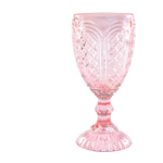 The Amber Vintage Glass is a stunning pink goblet with an intricate, textured design and ribbed base, reminiscent of vintage-style amber glass. Available exclusively through T3 Event Rentals for events in Dahlonega, it sits beautifully against a plain white background. Make your occasion unforgettable with T3s elegant rental offerings.