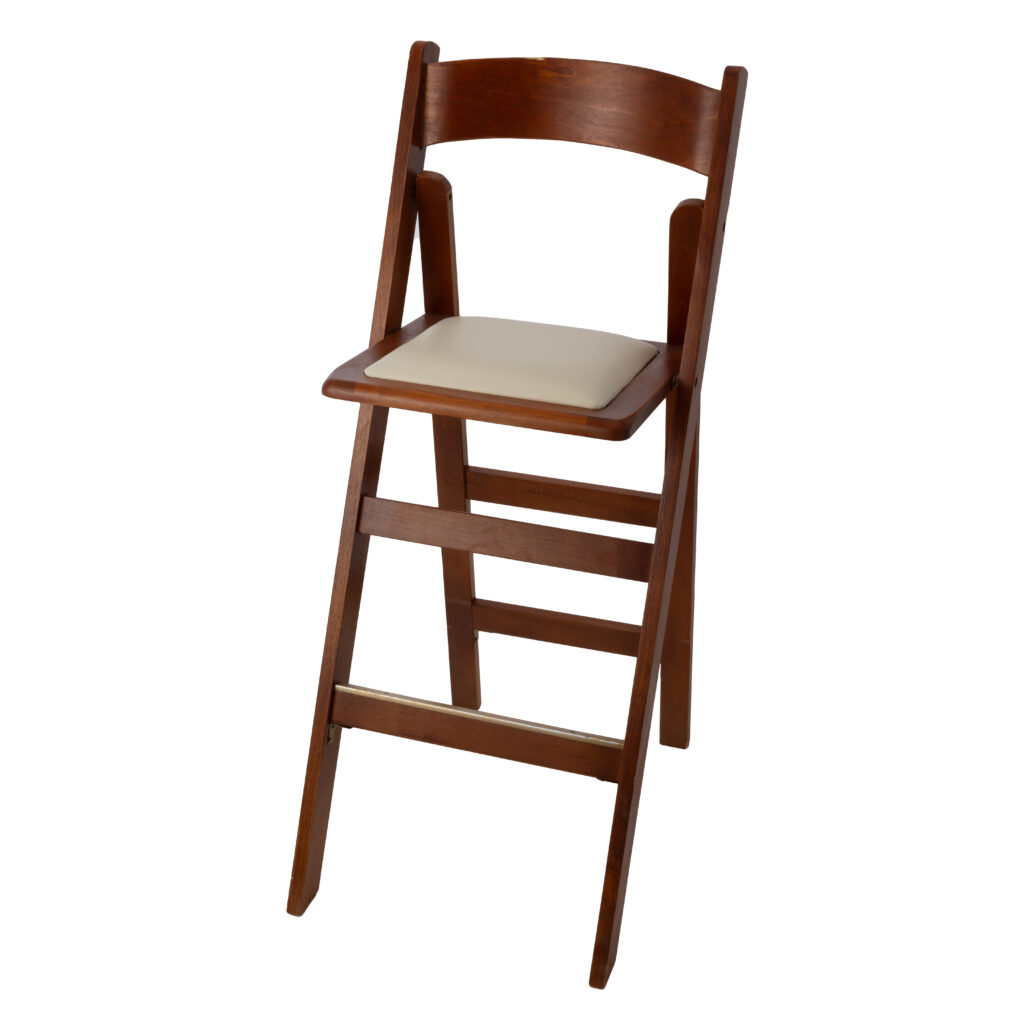 The Wood Folding Barstool from T3 Event Rentals is a versatile seating option available for rent in Forsyth County. This tall wooden chair, complete with a backrest and light cushioned seat, boasts a simple yet classic design. Its dark brown finish adds timeless elegance to any event space in the North Georgia region. Trust T3 Event Rentals to elevate your gathering with quality furnishings that create memorable atmospheres throughout Forsyth County and beyond.
