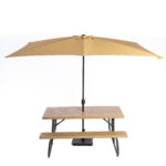 Discover the ideal addition to your outdoor event in Atlanta with T3 Event Rentals: a charming 6 folding picnic table complete with attached benches, all elegantly arranged under a large beige umbrella against a pristine white backdrop. Perfect for creating memorable gatherings, this stylish setup is available for rent exclusively through T3 Event Rentals.