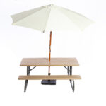 Elevate your event experience in Atlanta with T3 Event Rentals 6 Folding Picnic Table. This rental features built-in benches and a cream-colored central umbrella supported by a robust wooden pole, all set against an elegant white background. Ideal for any Atlanta gathering, trust T3 Event Rentals to provide quality and style.