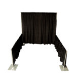 Discover the ideal rental solution for your next trade show with a sleek 10x20 exhibition booth from T3 Event Rentals. Perfectly designed for events in Atlanta, this booth features a sophisticated pipe and drape design with three metal-framed, fabric sides and an elegant 8 back. The open front is complemented by curtains that create a cozy, enclosed space. Based in Alpharetta, T3 Event Rentals caters to all your event needs in the Atlanta area.