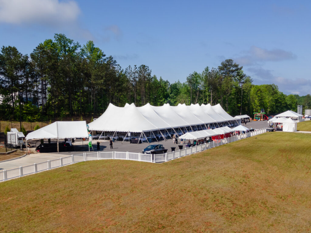 Aerial event photo of our 60' rope and pole tent along with several other tents.