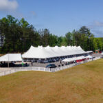 Aerial event photo of our 60' rope and pole tent along with several other tents.