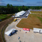 Aerial event photo of our 60' rope and pole tent along with several other tents.