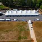 Aerial event photo of our 60' rope and pole tent along with several other tents.