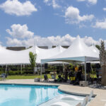 Event photo of our 60' rope and pole tent with a smaller high peak tent in the foreground.