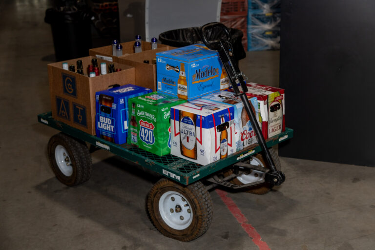A cart full of boxes of beer