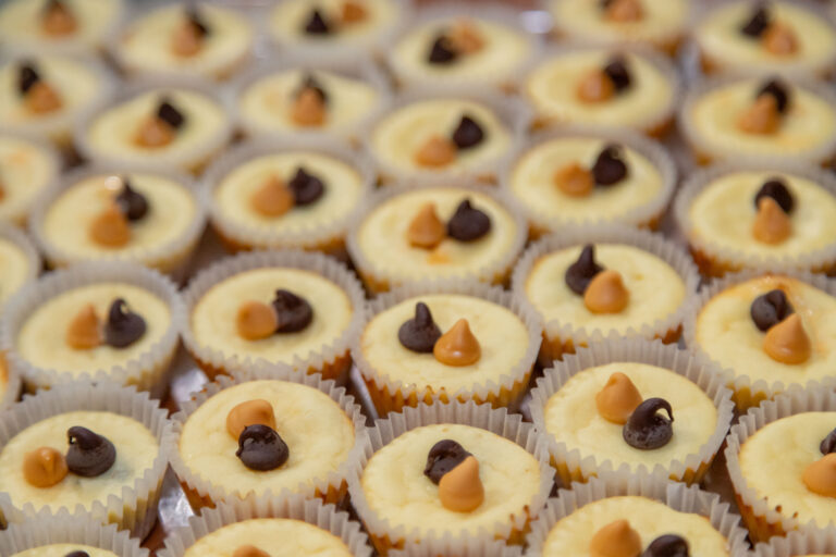 Close up of individual disk on table spread of food