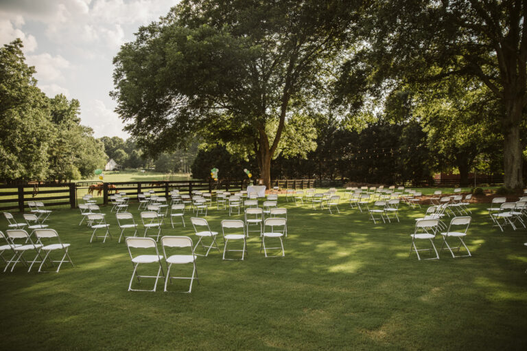 White aluminum chairs in a yard