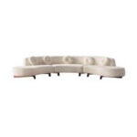 Cream-colored, modern curved sofa rental with tufted circular backrest accents and short wooden legs, showcased against a white background. Available exclusively from T3 Event Rentals for elegant Forsyth County gatherings and special events. All items are rentals only—perfect seating solution for your next celebration!.