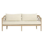 A chic beige cushioned wooden sofa with open lattice-style back and sides, featuring two large backrest pillows and a modern minimalist design—available for rent from T3 Event Rentals for your next Atlanta event. Elevate your gathering with stylish furniture rentals from T3 Event Rentals in Atlanta!.