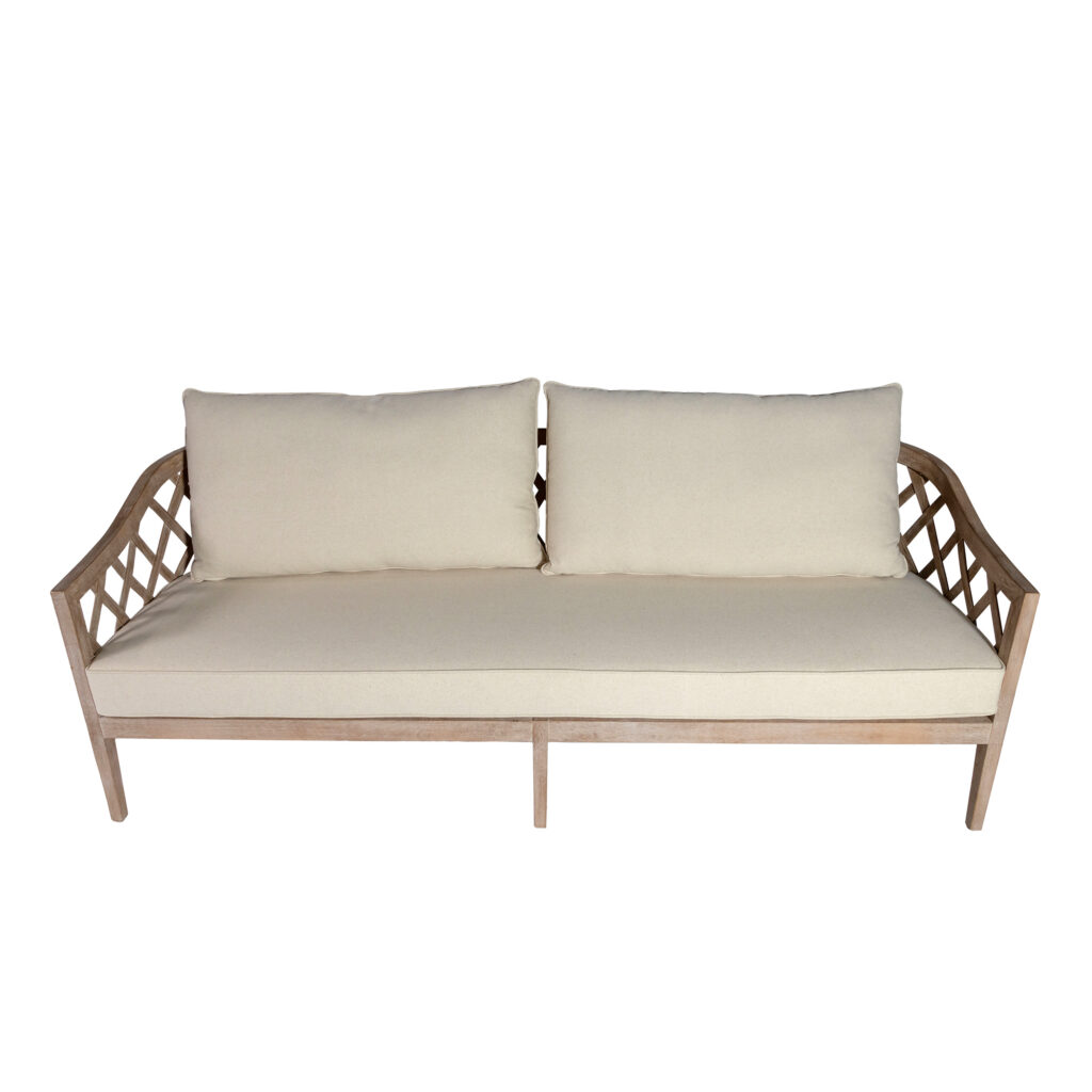 The Ellenwood Sofa-3ppl Ivory from T3 Event Rentals is a stylish 3-seater with an elegant wooden frame, plush ivory cushions, and chic lattice armrests. Shown here from the front against a white background, this rental sofa is available for events in Dawsonville through T3 Event Rentals. Perfect for adding comfort and sophistication to your next gathering!.