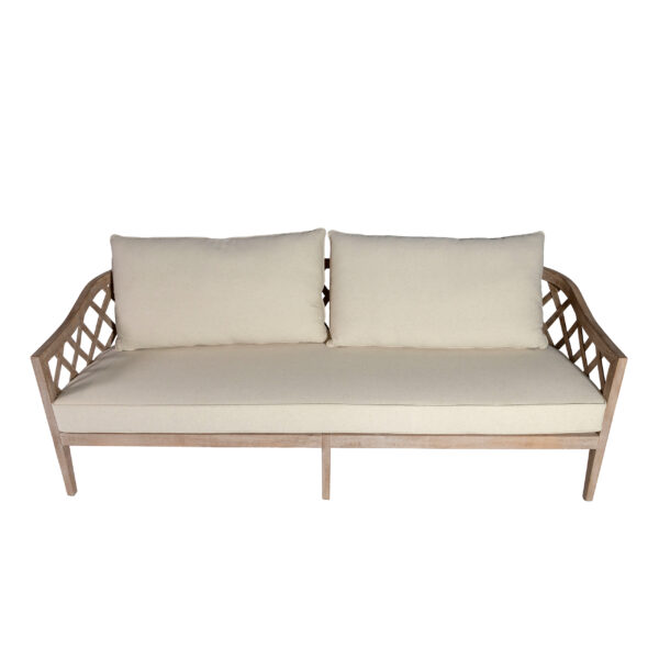 The Ellenwood Sofa-3ppl Ivory from T3 Event Rentals is a stylish 3-seater with an elegant wooden frame, plush ivory cushions, and chic lattice armrests. Shown here from the front against a white background, this rental sofa is available for events in Dawsonville through T3 Event Rentals. Perfect for adding comfort and sophistication to your next gathering!.