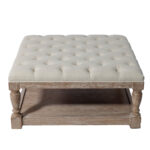 Elevate your next Atlanta event with T3 Event Rentals square, tufted ivory ottoman featuring sturdy wooden legs and a convenient open lower shelf for storage. Perfect as an accent piece or paired seamlessly with the Roswell Coffee Table Ivory, this elegant rental item adds both style and function to any Atlanta celebration.