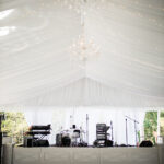 T3 Event Rentals offers twinkle-lit white tent stages in Atlanta, with rentable drums, keyboard, and audio gear—nothing for sale.