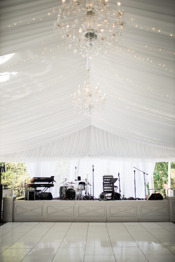 T3 Event Rentals offers twinkle-lit white tent stages in Atlanta, with rentable drums, keyboard, and audio gear—nothing for sale.