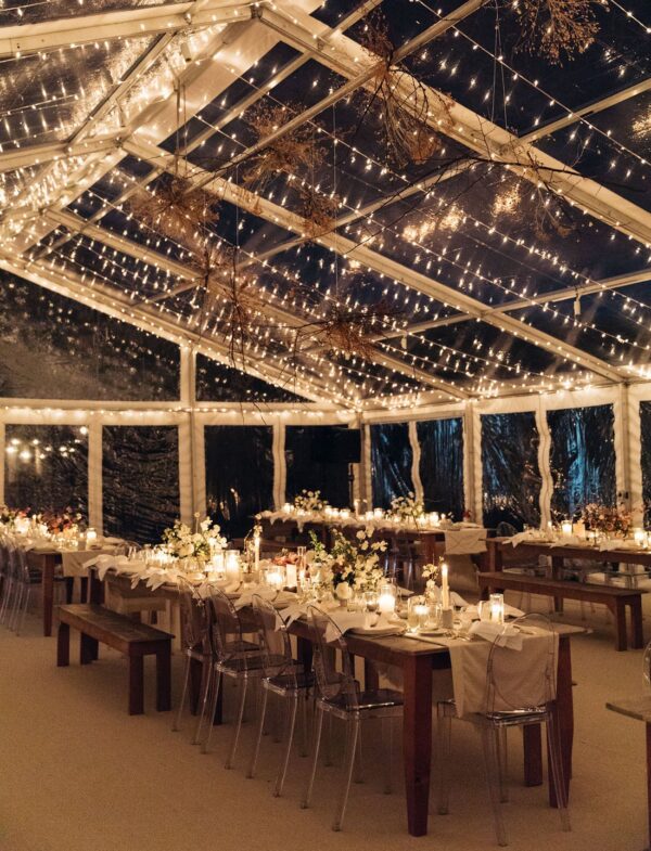 T3 Event Rentals creates a romantic vibe in Dahlonega with clear tents, twinkle lights, and elegant decor for evening events.