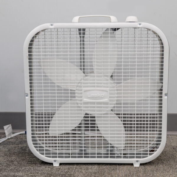 A five-blade box fan from T3 Event Rentals sits on carpet in Dawsonville, ready for your next event rental. Brand visible.