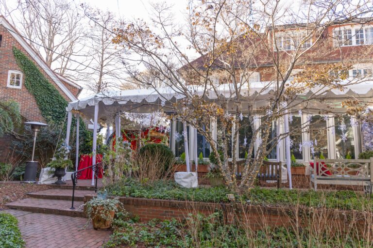 Custom tent installation with marquee tents and covered walkways for a holiday event