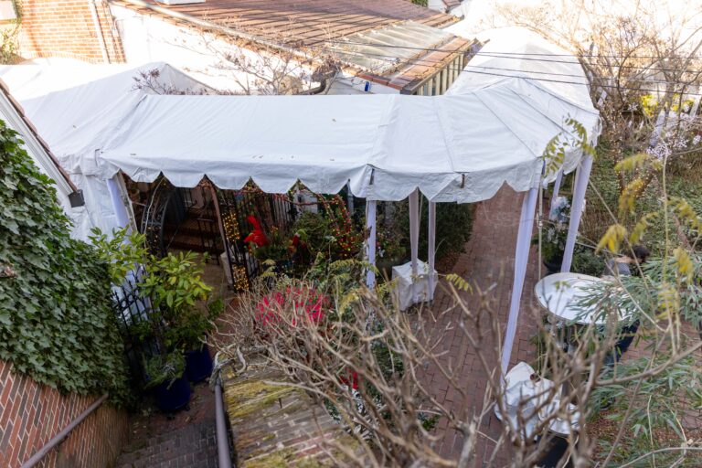 Custom tent installation with marquee tents and covered walkways for a holiday event