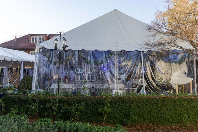 Custom tent installation with marquee tents and covered walkways for a holiday event