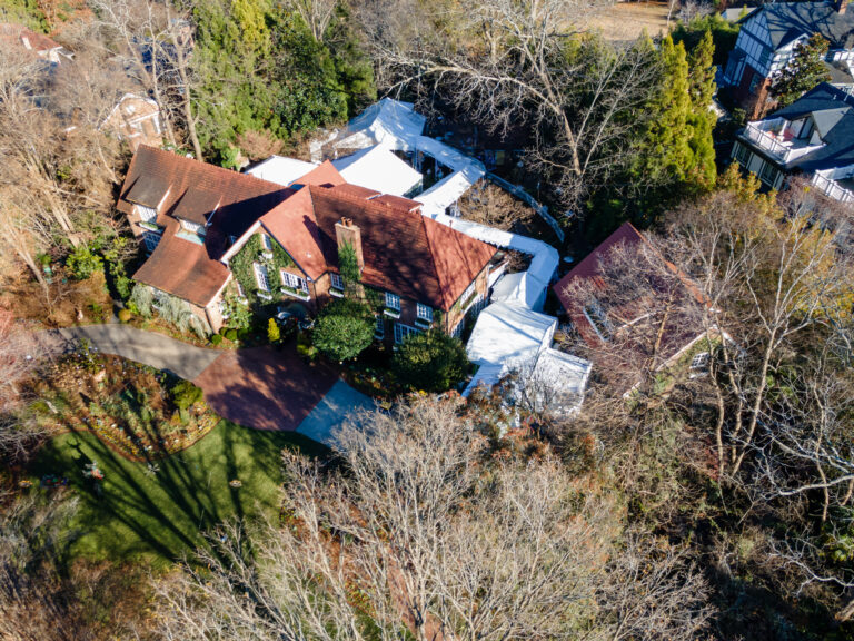 Custom tent installations showing connected marquee tents in a residential backyard